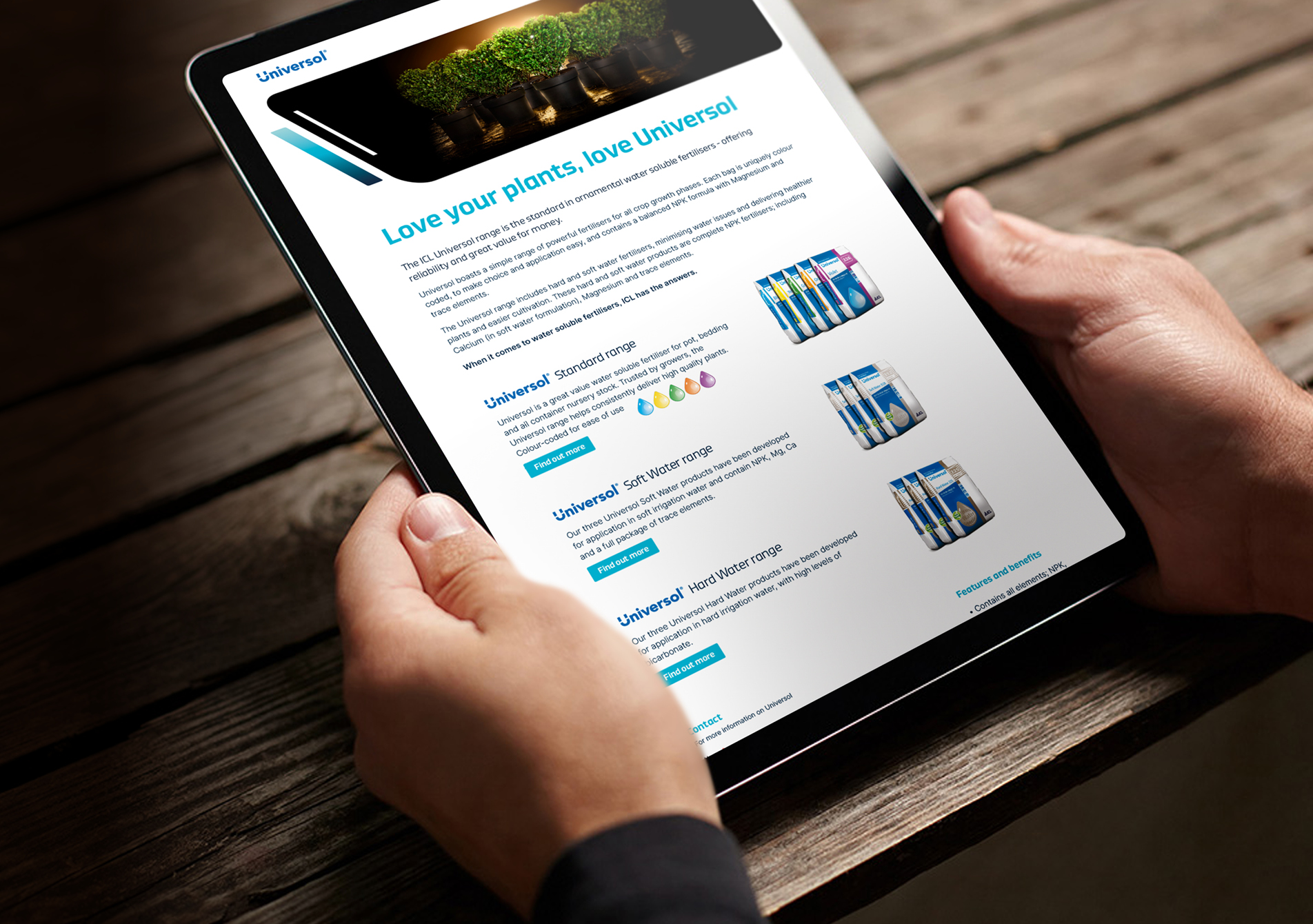 Person holding an iPad displaying the ICL website