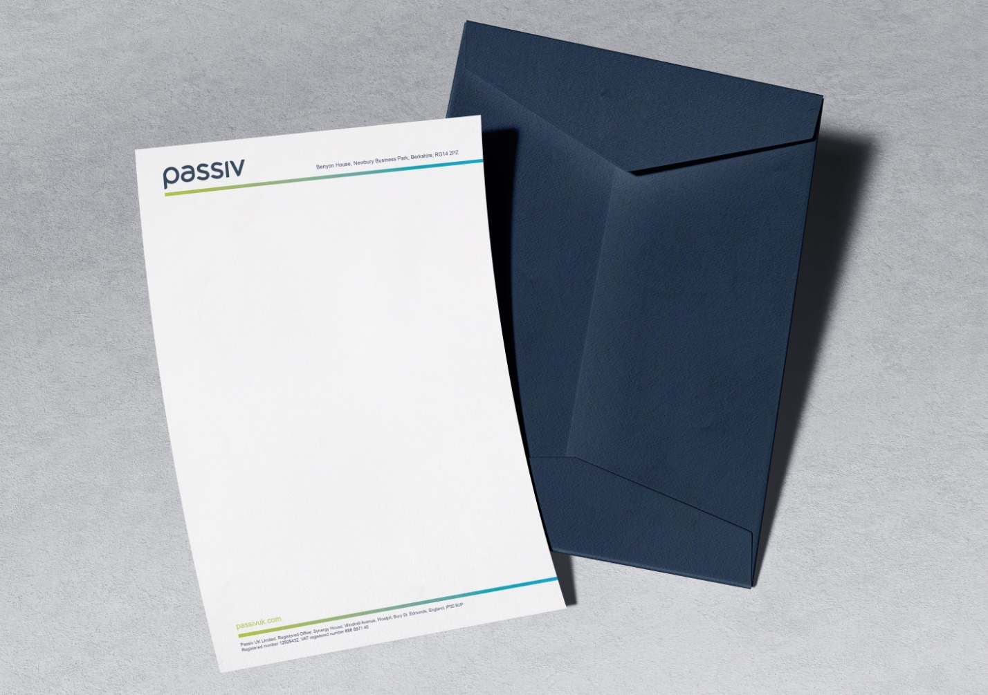 Passiv letterhead and envelope on a grey background