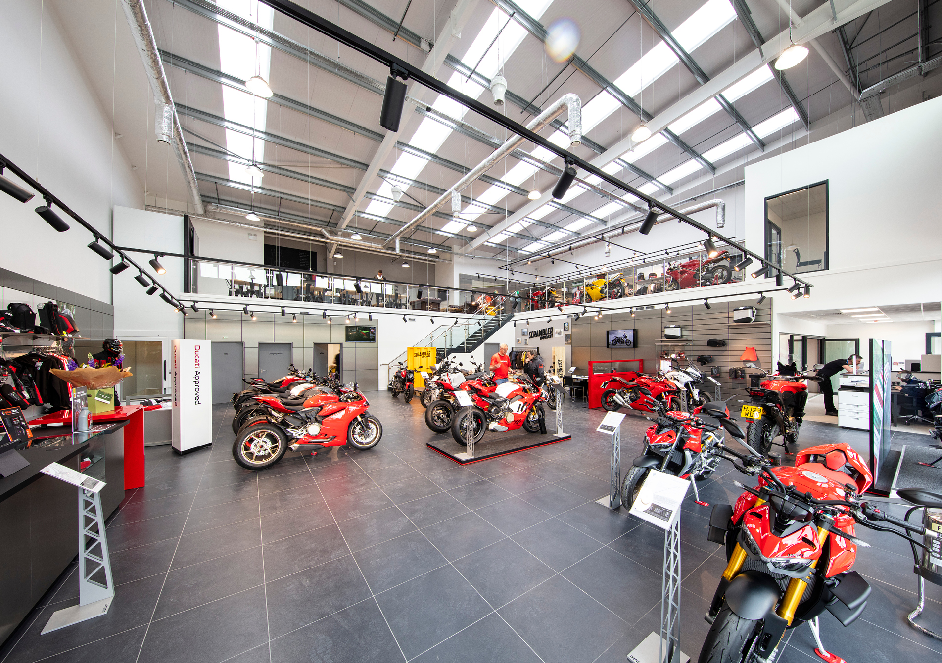 An internal image of an industrial unit with motorbikes on display