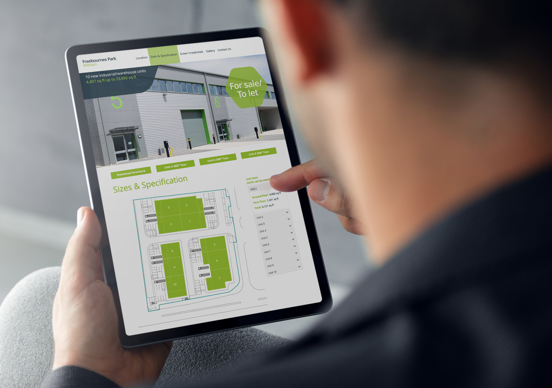 A person holding an iPad scrolling through a Chancerygate development website