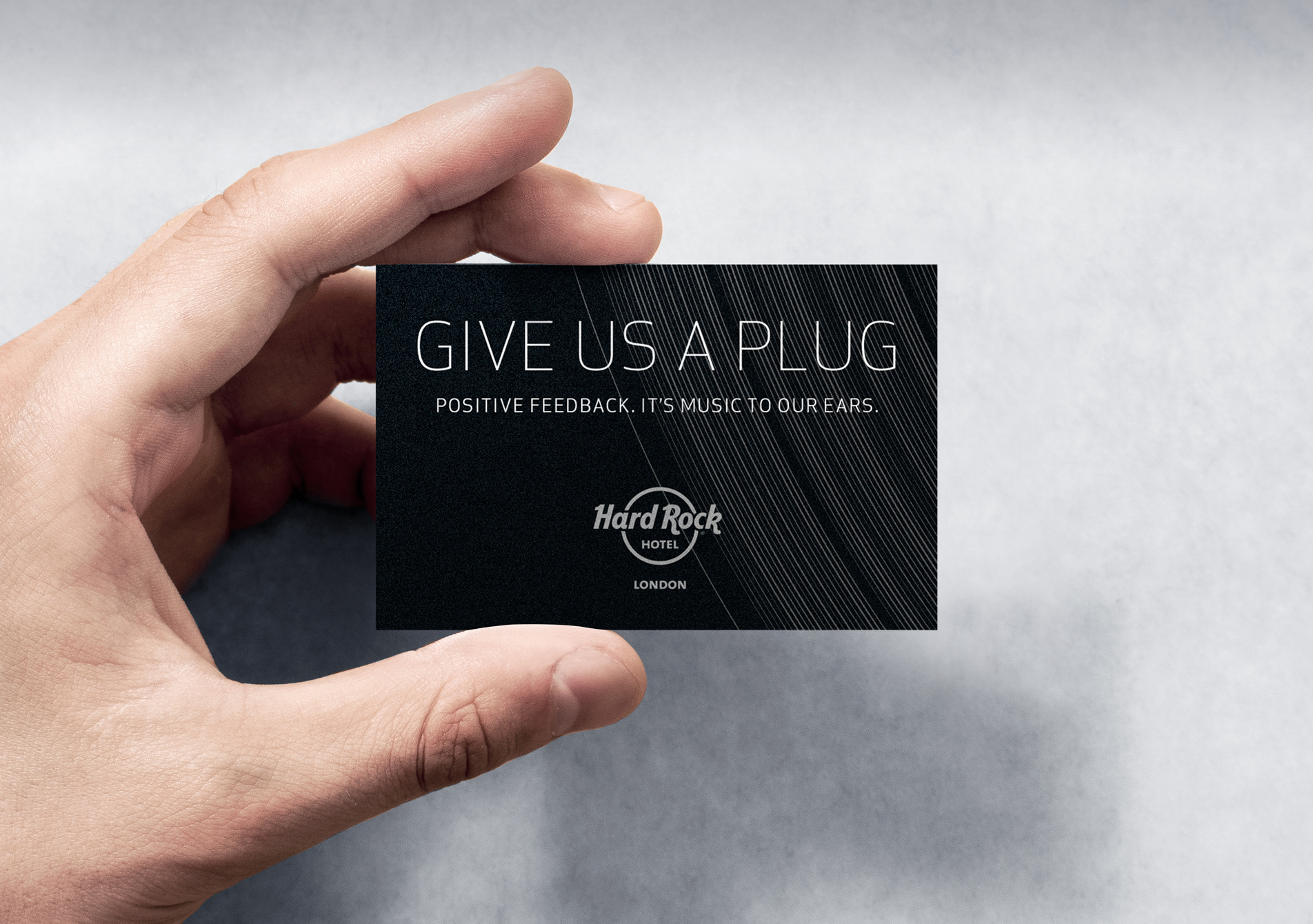 Hand holding Hard Rock Hotel London TripAdvisor feedback request print design business card