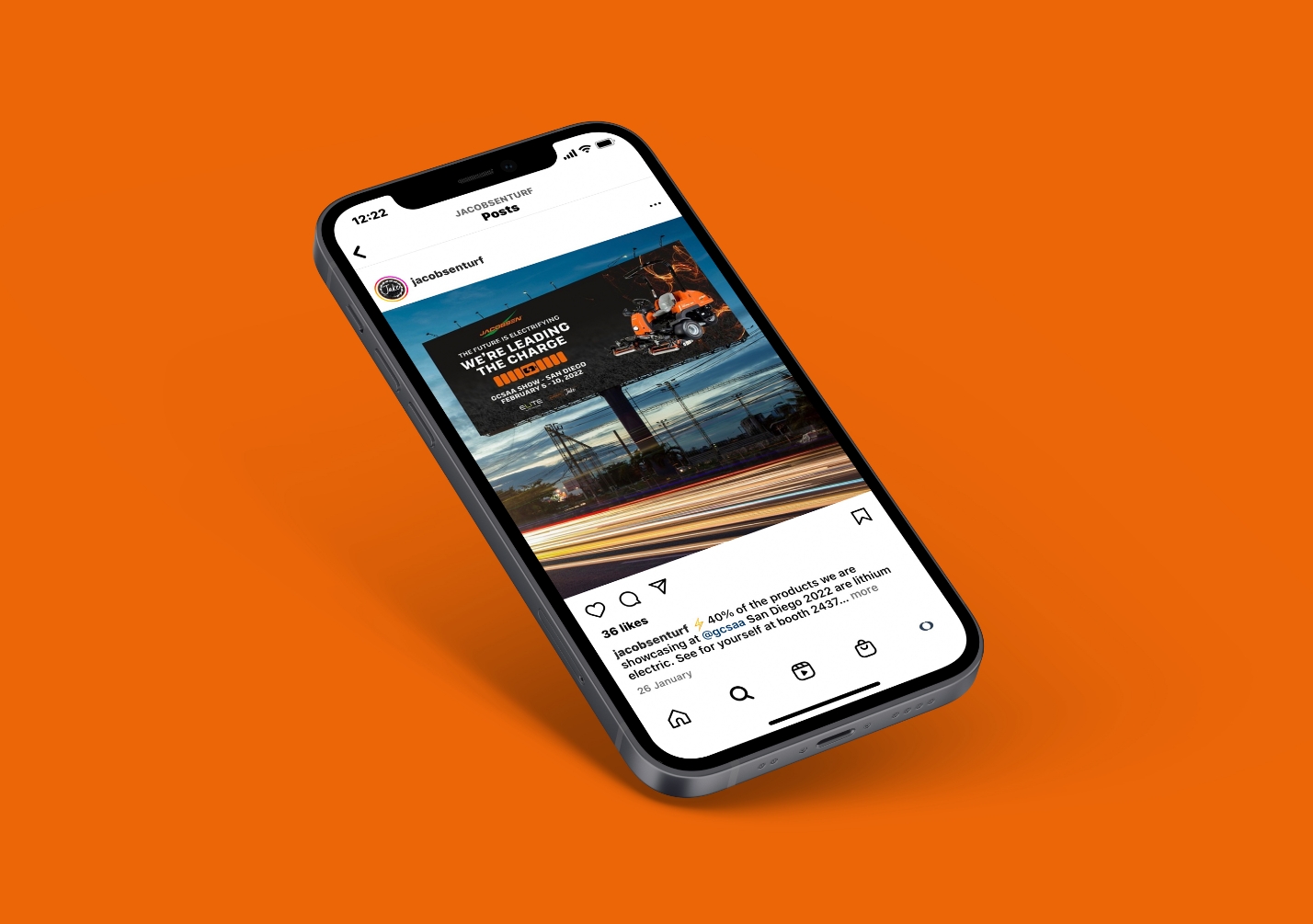 iPhone showing a Jacobsen Instagram post on an orange background