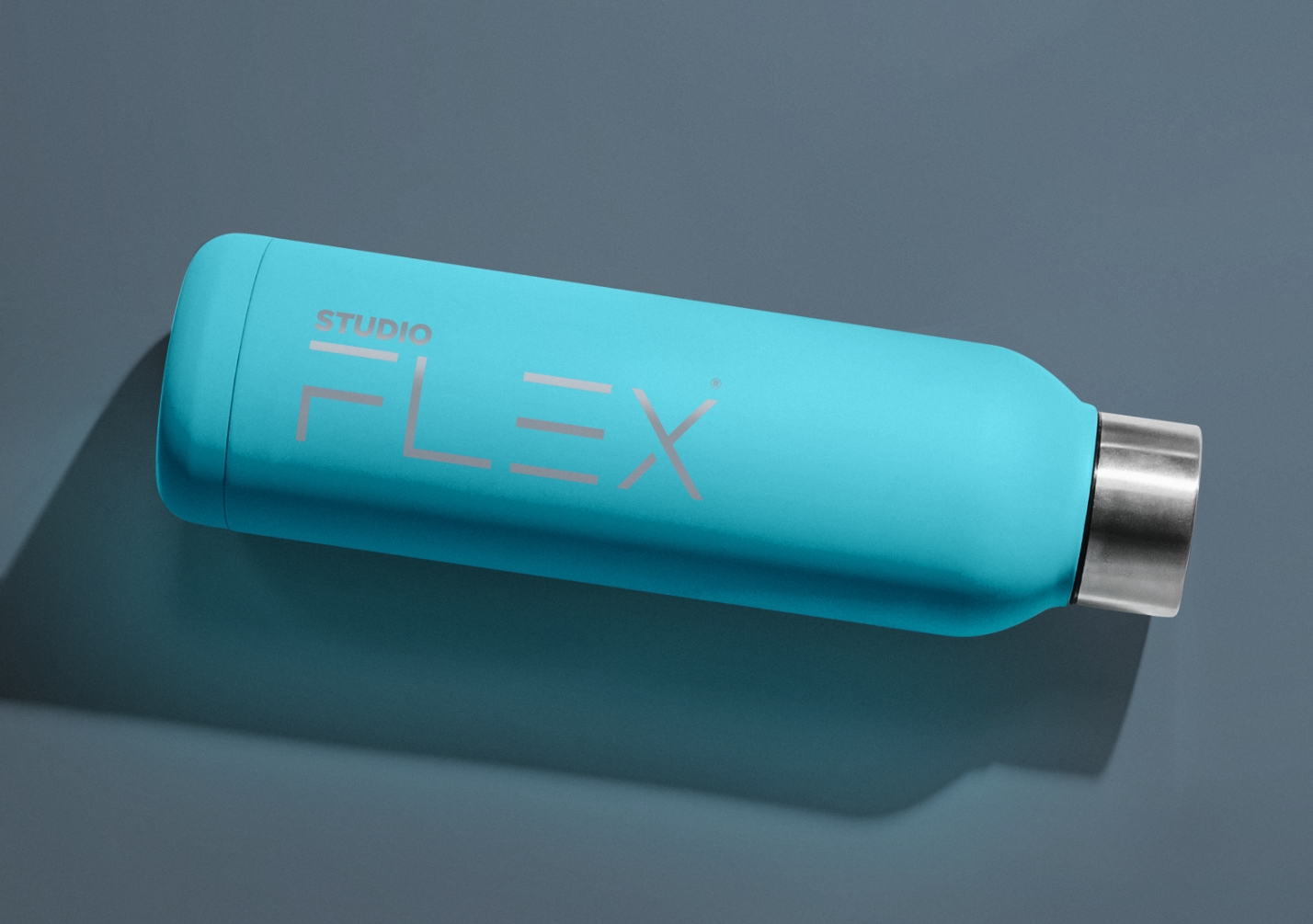 Print design for Studio Flex logo on a water bottle displayed on a grey background