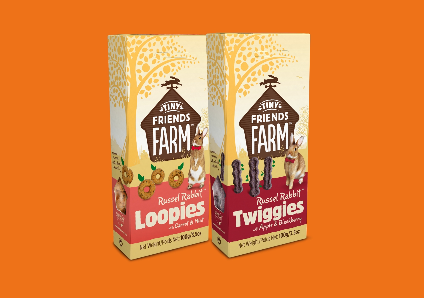 Two boxes of Tiny Friends Farm treats on an orange background